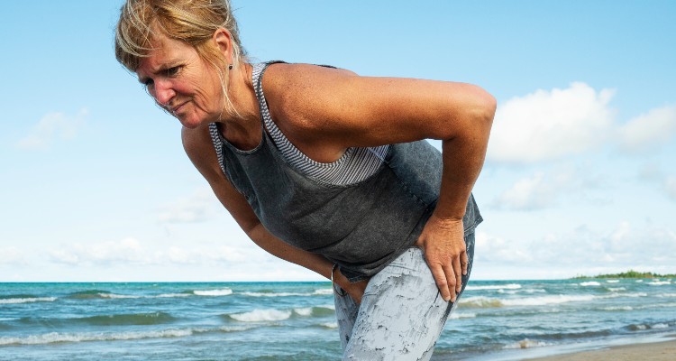 hip specialist near syracuse ny image of woman holding her hip